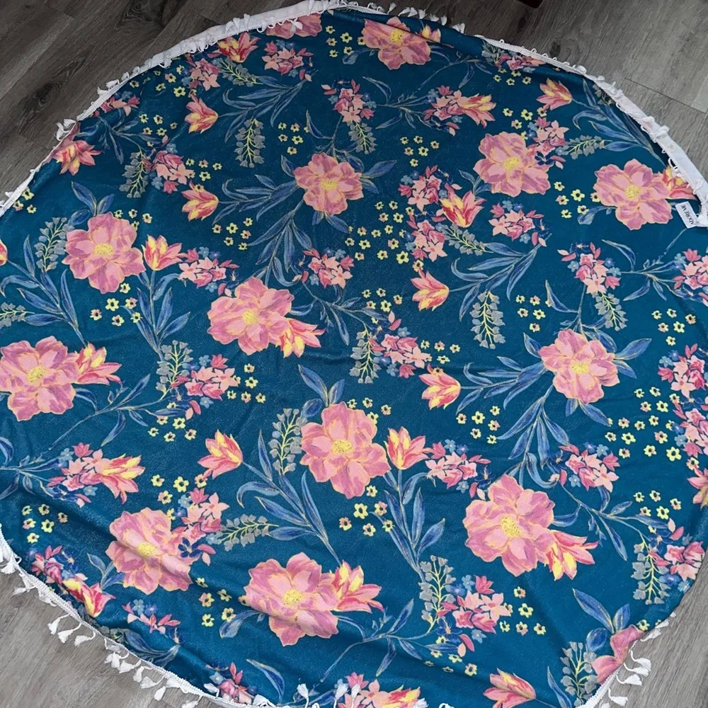 Adore Me round beach towel with tassels. 60” in diameter.
